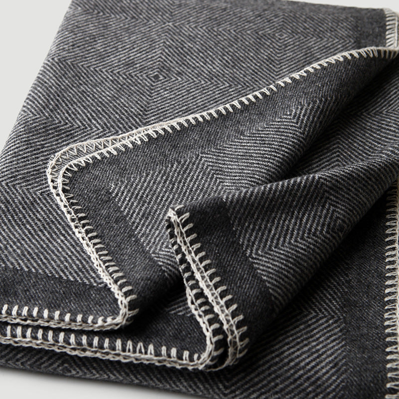 Blanket-stitch edge herringbone wool throw